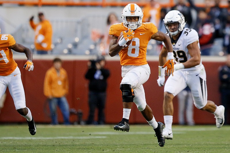 Ty Chandler carries the ball for Tennessee during a home game against Missouri in November 2018.