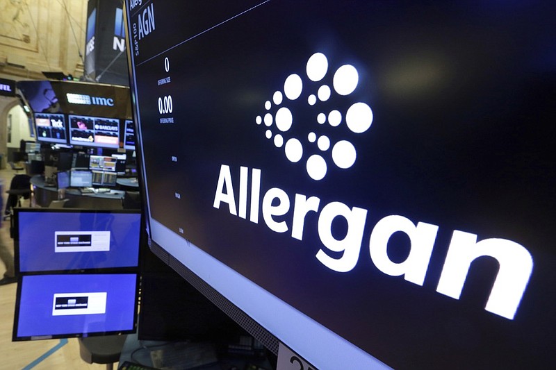 In this Monday, Nov. 23, 2015, file photo, the Allergan logo appears above a trading post on the floor of the New York Stock Exchange. On Wednesday, July 24, 2019, the medical device maker announced a worldwide recall of its Biocell breast implants which are linked to a rare form of cancer. (AP Photo/Richard Drew, File)