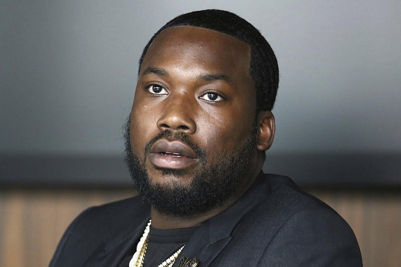 In this Tuesday, July 23, 2019 photo, Meek Mill makes an announcement of the launch of Dream Chasers record label in joint venture with Roc Nation, at the Roc Nation headquarters in New York. A Pennsylvania appeals court has thrown out rapper Meek Mill's decade-old conviction in a drug and gun case. The unanimous three-judge opinion Wednesday grants the rapper born Robert Williams a new trial because of new evidence of alleged police corruption. (Photo by Greg Allen/Invision/AP)