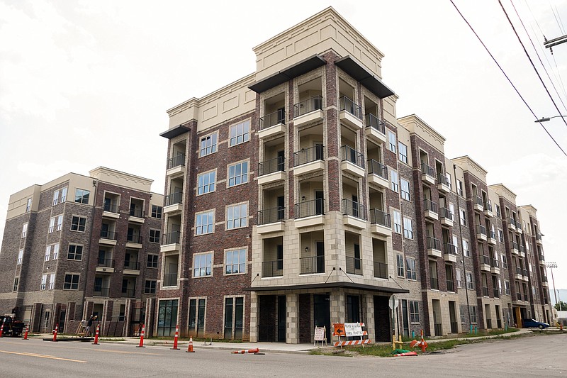 Staff photo by Doug Strickland / An apartment building under construction at 1701 Broad St., adjacent to the Pilgrim's Pride chicken processing facility, is slated to open this fall after a delay.