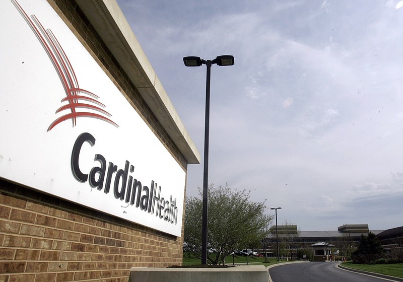 This April 30, 2007, file photo, shows the headquarters of Cardinal Health in Dublin, Ohio. An executive at Cardinal Health, one of the nation's largest drug distribution companies, said in a legal proceeding that the business has no obligation to the public when it comes to shipping prescription opioid painkillers. That's one of the disclosures in thousands of pages of court documents made public July 23, 2019, in lawsuits over the opioid crisis. (AP Photo/Kiichiro Sato, File)