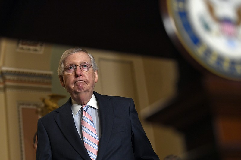 Senate Majority Leader Mitch McConnell of Ky., arrives to speak with reporters following the weekly policy lunches on Capitol Hill in Washington, Tuesday, July 23, 2019. (AP Photo/Susan Walsh)