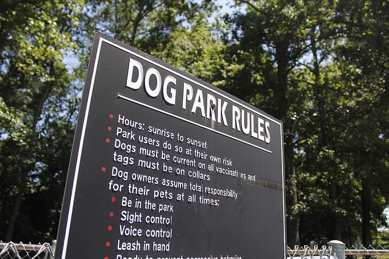 A sign detailing the rules of the current Collegedale Dog Park sits outside of the recreation area for dogs. Collegedale is the recipient of a $25,000 grant to further expand the park. / Photo by Tierra Hayes