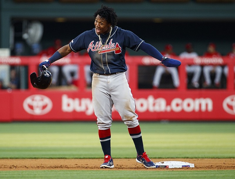 The Atlanta Braves' Ronald Acuna Jr. reacts after stealing second base and being confirmed as safe by video review during the first inning of Friday's game against the host Philadelphia Phillies.