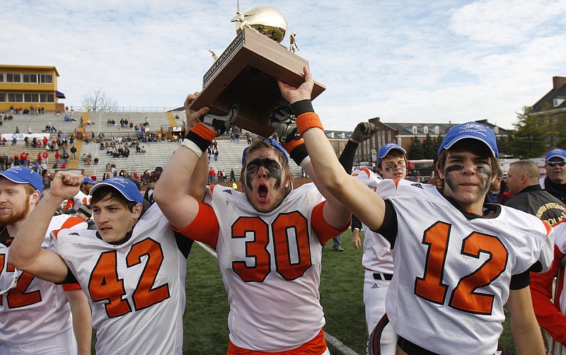 Staff Photo by Dan Henry/Chattanooga Times Free Press - {iptcmonthname3} 3, 2010 - South Pittsburg players Josh Parker (42), Josh Wilson (30) and Travis Millard (12) celebrate their win over Jo Byrns with a final score of 41-6 during the Division I Class A state championship game Friday afternoon in Cookeville, Tenn. 