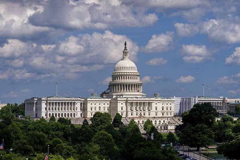 In this June 20, 2019, file photo, the Capitol is seen from the roof of the Canadian Embassy in Washington. America's much-maligned health care system is covering more people than ever, a fact lost on many of the 2020 presidential candidates, who keep debating polarizing ideas about how to set up coverage, from Sen. Bernie Sanders' call for replacing private insurance with a government plan, to President Donald Trump's determination to erase "Obamacare."