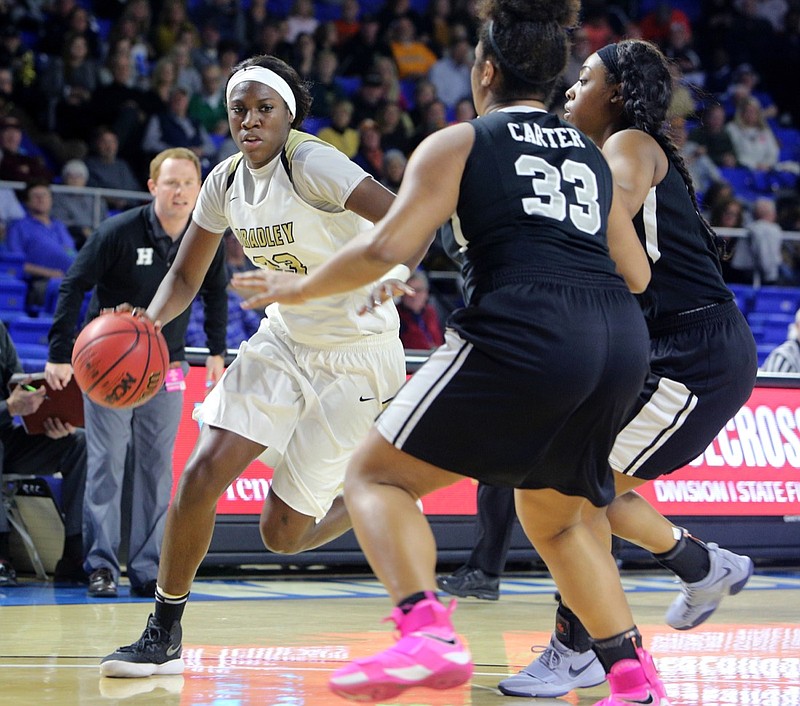 Bradley Central's Rhyne Howard (23) dribbles the ball downcourt while being guarded by Houston's Melisa Carter (33) during the Bradley Central vs. Houston girls' Class AAA state basketball tournament semifinal game Friday, March 9, 2018, in Murphy Center at Middle Tennessee State University in Murfreesboro, Tenn.