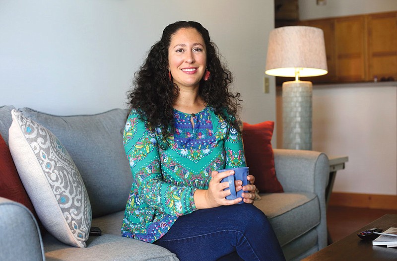 Erin Spahn poses for a photo at her parents' condo in Chattanooga.