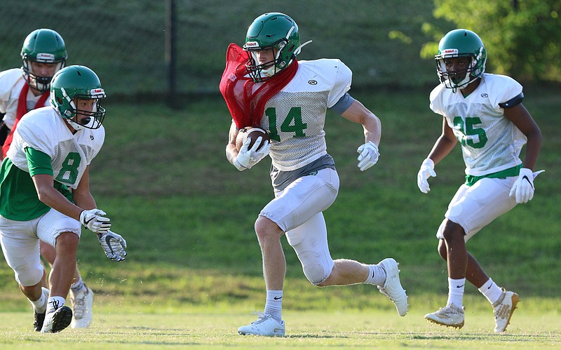 East Hamilton's Cade Meeks (14) runs the ball at the East Hamilton High School practice field during practice Monday, July 29, 2019 in Ooltewah, Tennessee. Monday was the first day teams were allowed to hold practice with full pads.