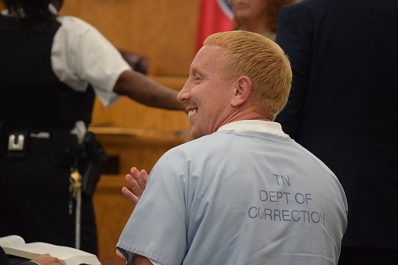 Adam Clyde Braseel, 36, gives a small wave to family members and supporters in the gallery during his June 26, 2019, hearing in Grundy County Circuit Court on a petition for a new trial in his 2007 first-degree murder conviction. The hearing is to reconvene Wednesday, July 31, 2019, before Judge Justin Angel.


