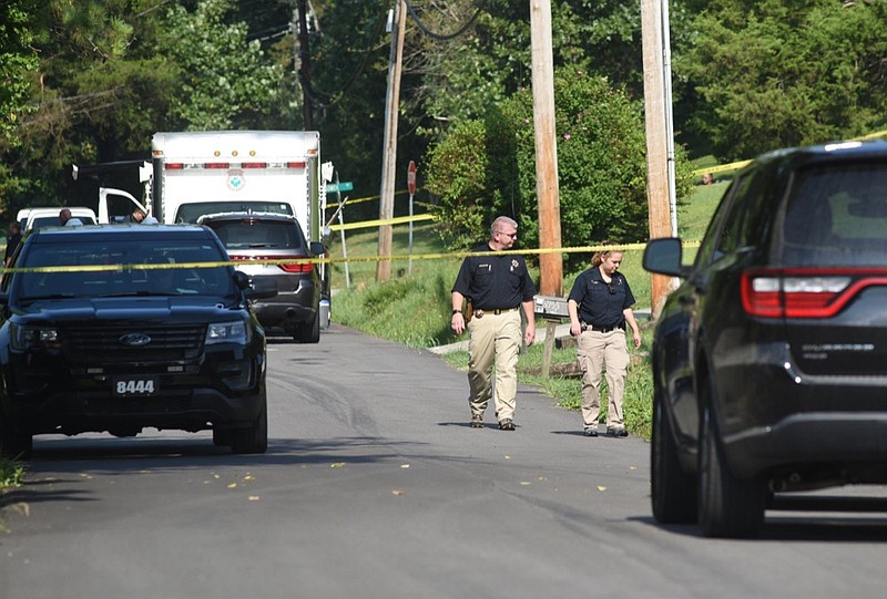 Hamilton County Sheriff's Department personnel work the scene on Kelly's Ferry Road where a Chattanooga police shot a man with a long gun early Wednesday morning. / Staff photo by Tim Barber 
