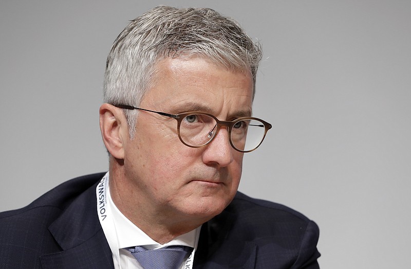 FILE - In this Thursday, May 3, 2018 file photo, Rupert Stadler, then CEO of Audi AG, attends the shareholders' meeting of the Volkswagen stock company in Berlin, Germany.  German prosecutors announced Wednesday July 31, 2019, that they have charged Rupert Stadler and three other individuals with fraud in connection with sales of diesel cars with software that enabled cheating on emissions tests. (AP Photo/Michael Sohn, FILE)
