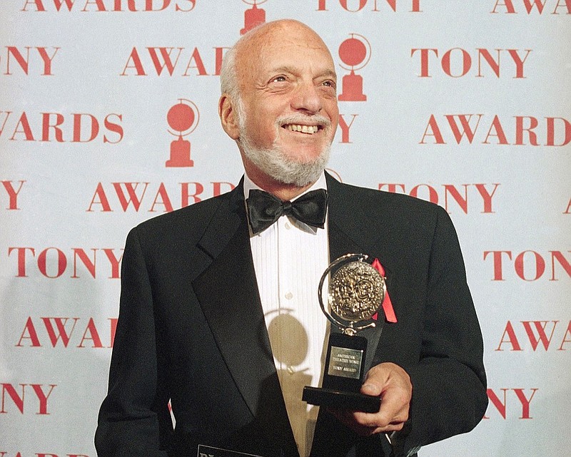 FILE - In this June 4, 1995 file photo, Harold Prince holds his Tony award for best director in a musical for "Show Boat,"at Broadway's Minskoff Theater in New York. "Prince of Broadway," a musical celebrating Prince, the most decorated Tony Award-winner in history, will make its Broadway debut next summer. (AP Photo/Richard Drew, File)