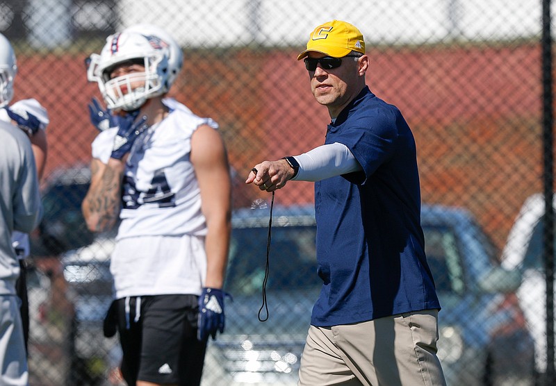 UTC head football coach Rusty Wright directs players on the first day of spring football practice at the University of Tennessee at Chattanooga's intramural athletic fields on Tuesday, March 19, 2019, in Chattanooga, Tenn. 