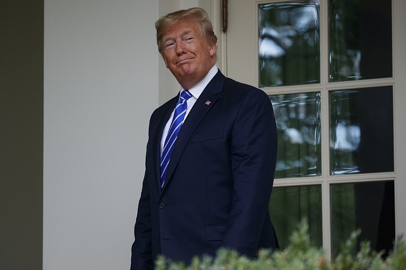 President Donald Trump walks into the Oval Office of the White House for a meeting with Mongolian President Khaltmaa Battulga, Wednesday, July 31, 2019, in Washington. (AP Photo/Evan Vucci)