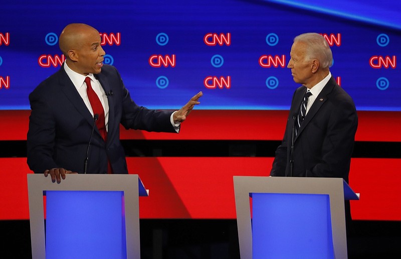 Sen. Cory Booker, D-N.J., gestures to former Vice President Joe Biden during the second of two Democratic presidential primary debates hosted by CNN Wednesday, July 31, 2019, in the Fox Theatre in Detroit. (AP Photo/Paul Sancya)