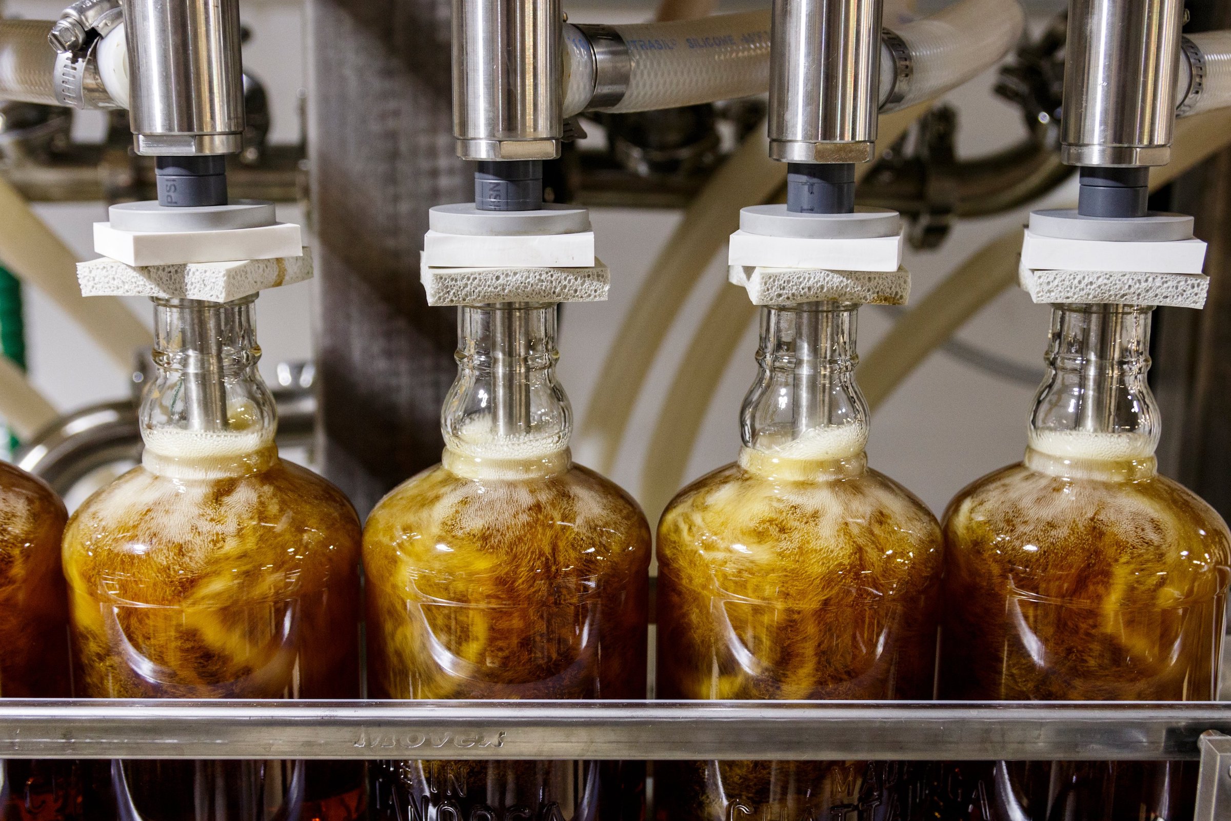 Bottles are filled in the bottling line at Chattanooga Whiskey's Martin Luther King Boulevard distillery on Wednesday, July 31, 2019, in Chattanooga, Tenn.. The company is in the process of releasing its new high-malt whiskey line made entirely in Chattanooga.