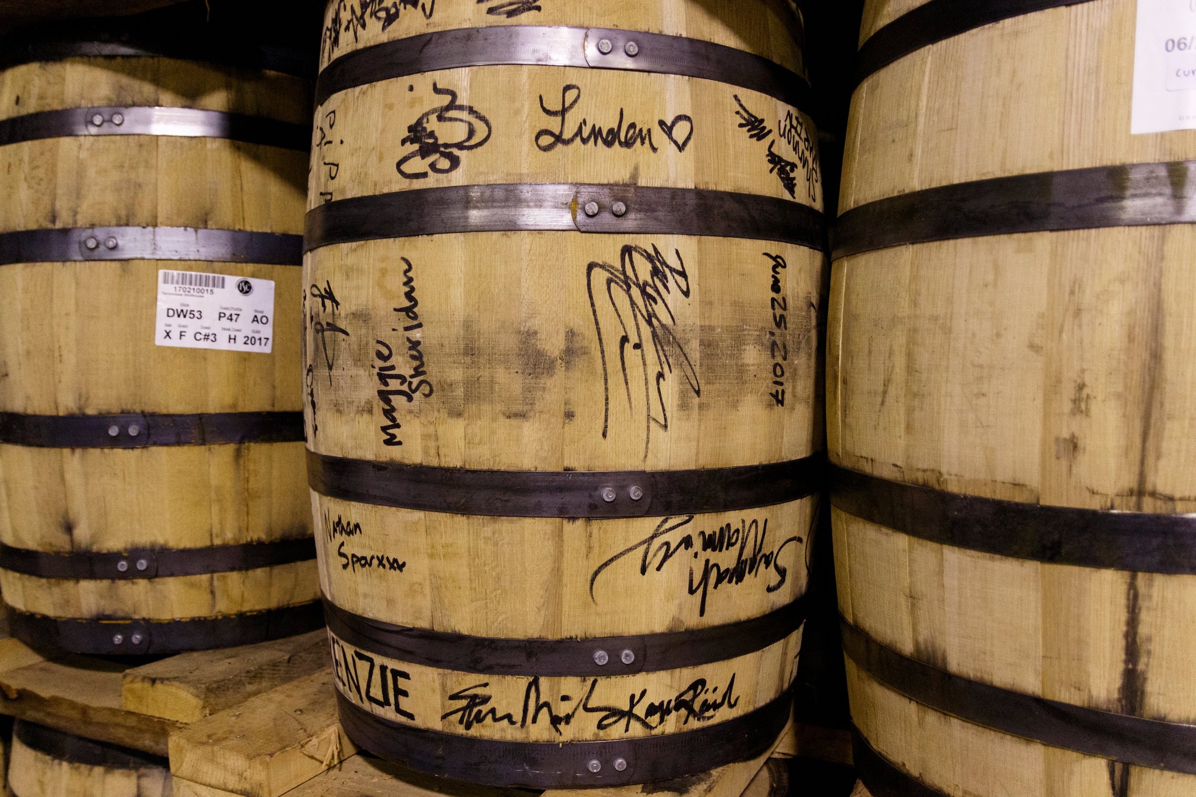 Signatures are seen on a barrel of whiskey aging at Chattanooga Whiskey's Martin Luther King Boulevard distillery on Wednesday, July 31, 2019, in Chattanooga, Tenn.. The company is in the process of releasing its new high-malt whiskey line made entirely in Chattanooga.