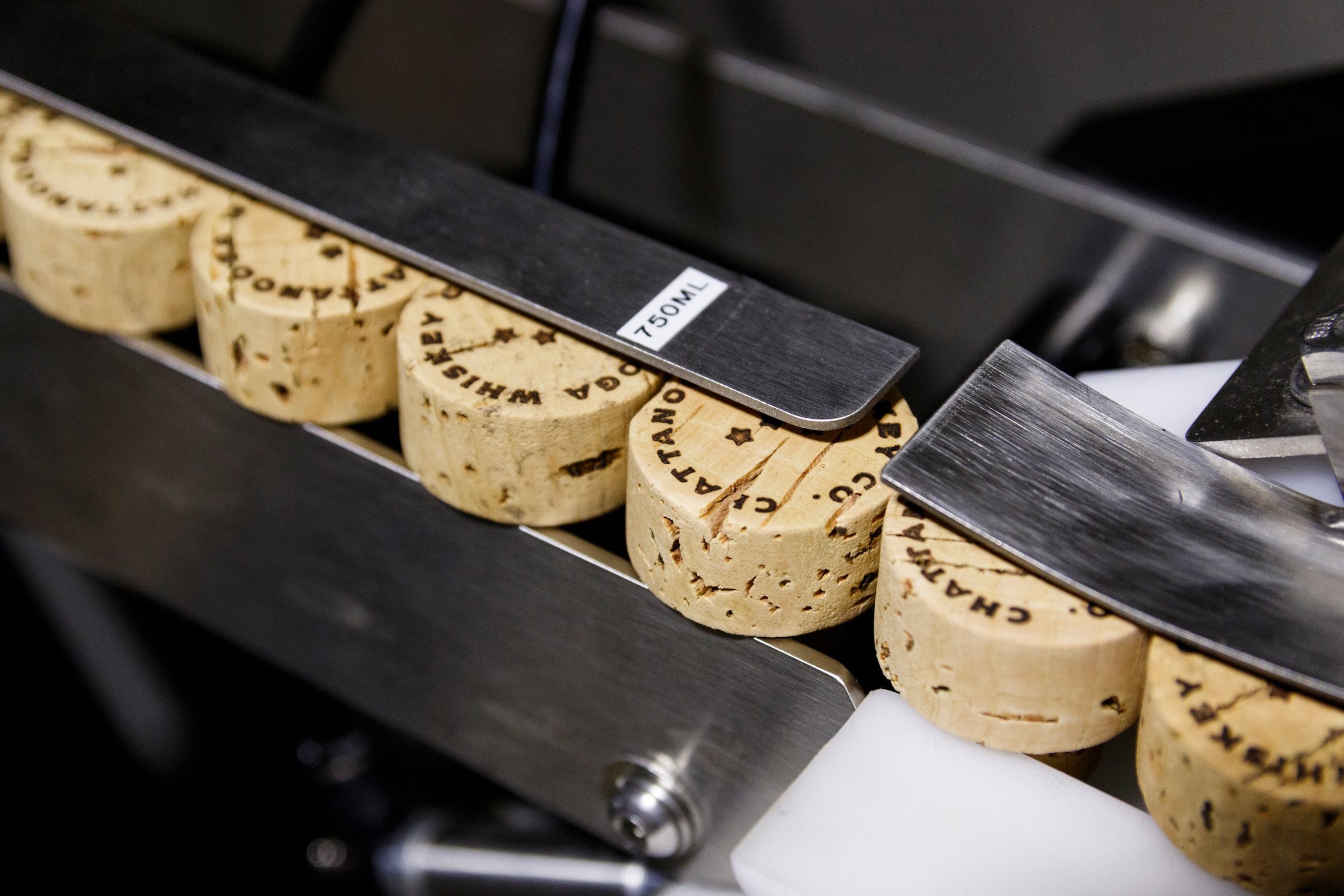 Corks are seen in the bottling line at Chattanooga Whiskey's Martin Luther King Boulevard distillery on Wednesday, July 31, 2019, in Chattanooga, Tenn.. The company is in the process of releasing its new high-malt whiskey line made entirely in Chattanooga.