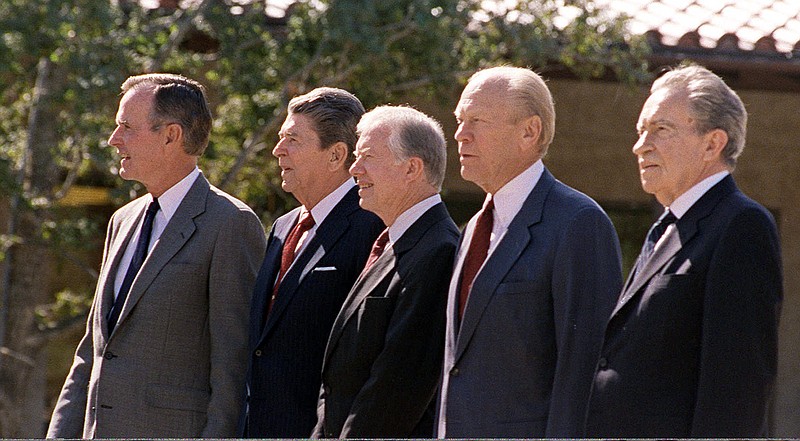 Former President Richard Nixon, right, shown with three other former U.S. presidents and then-President George Bush at the 1991 dedication of the Ronald Reagan Presidential Library, once proposed a guaranteed minimum income.