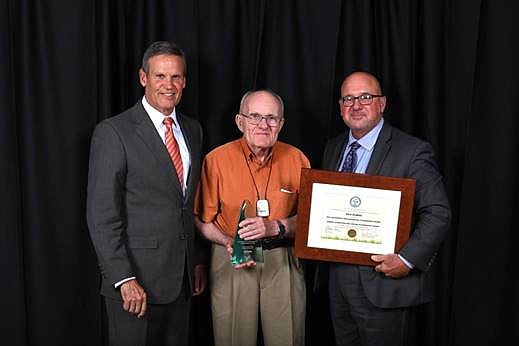 Gov. Bill Lee, left, joins Kenneth Dubke, winner of the 2019 Robert Sparks Walker Lifetime Achievement Award, center, and TDEC Commissioner David Salyers at the Governor's Environmental Stewardship Awards on Thursday, August 1, 2019, in Franklin. / Photo provided by the Tennessee Department of Environment and Conservation