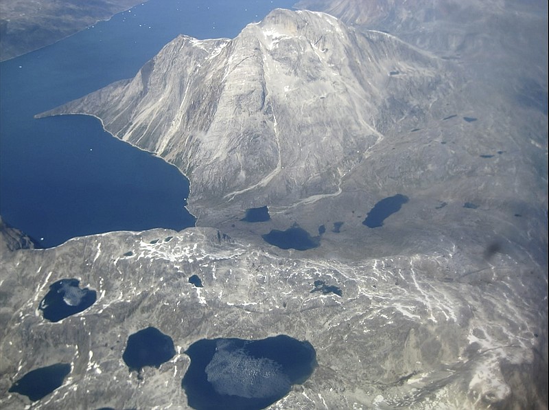 In this image taken on June 22, 2019 an aerial view of melt water lakes on the edge of an ice cap in Nunatarssuk, Greenland. Milder weather than normal since the start of summer, led to the UN's weather agency voicing concern that the hot air which produced the recent extreme heat wave in Europe could be headed toward Greenland where it could contribute to increased melting of ice. (AP Photo/Keith Virgo)