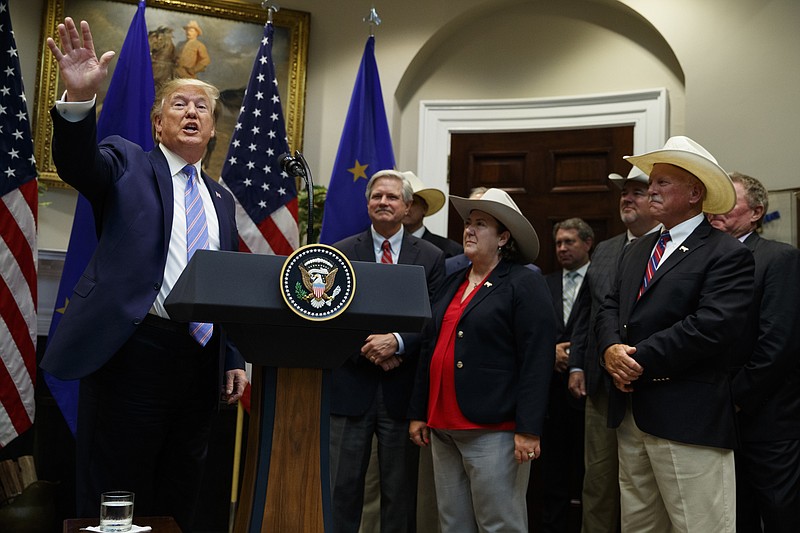 President Donald Trump waves as he leaves an event announcing expanded U.S. beef exports to the European Union, in the Roosevelt Room of the White House, Friday, Aug. 2, 2019, in Washington. (AP Photo/Evan Vucci)