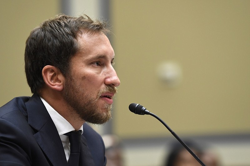FILE - In this July 25, 2019, file photo, JUUL Labs co-founder and Chief Product Officer James Monsees testifies before a House Oversight and Government Reform subcommittee on Capitol Hill in Washington. Juul Labs gave nearly $100,000 to members of Congress during the first half of 2019 as the company faced the bulk of the blame for a surge of underage vaping and calls for tighter government regulation of the industry.(AP Photo/Susan Walsh, File)