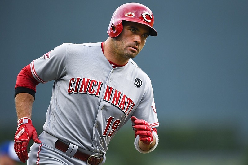 Cincinnati Reds' Joey Votto rounds third base on his two-run home run during the first inning of the team's baseball game against the Atlanta Braves, Friday, Aug. 2, 2019, in Atlanta. (AP Photo/John Amis)