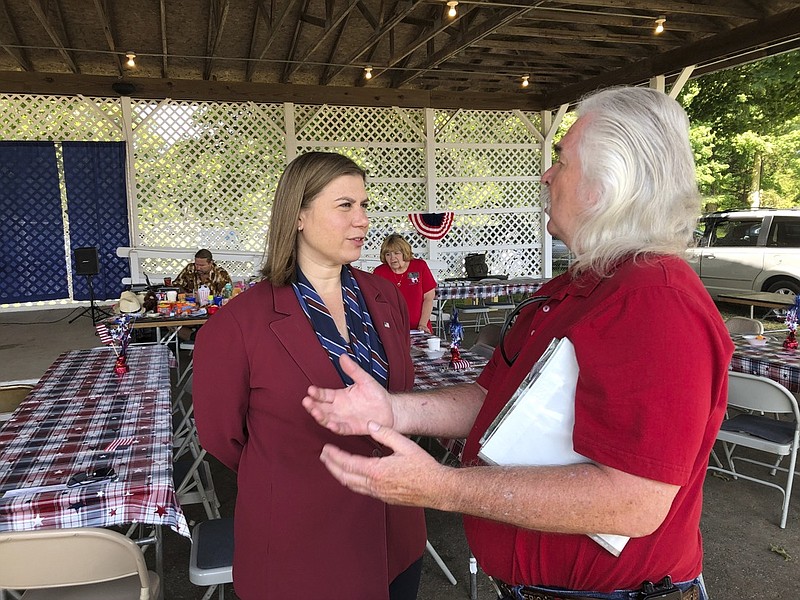 Rep. Elissa Slotkin, D-Mich., talks with a constituent after a veterans event on Friday, Aug. 2, 2019, at the Ingham County Fair in Mason, Mich. Slotkin, who flipped the 8th Congressional District by defeating a Republican incumbent in 2018, has not backed an impeachment inquiry of President Donald Trump. (AP Photo/David Eggert)