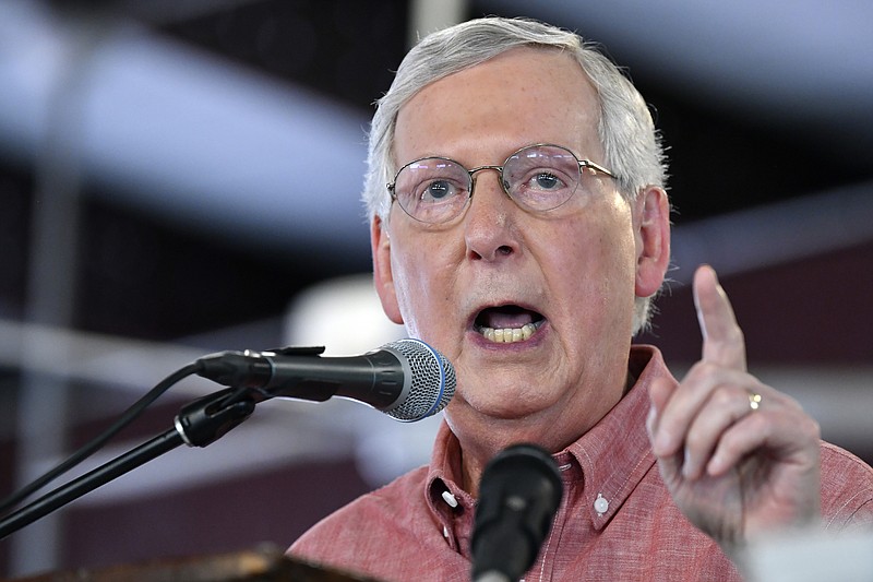 In this Saturday, Aug. 3, 2019 photo, Senate Majority Leader Mitch McConnell, R-Ky., addresses the audience gathered at the Fancy Farm Picnic in Fancy Farm, Ky. A spokesman for Mitch McConnell says the Senate majority leader tripped outside his home in Kentucky and suffered a shoulder fracture. McConnell fell on his outdoor patio, but has been treated and released after getting medical attention. (AP Photo/Timothy D. Easley)

