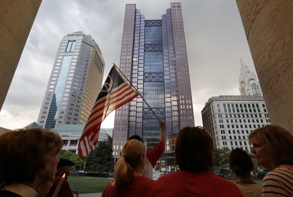 A candlelight vigil was held at Ohio Statehouse Sunday evening in Columbus following mass shootings in El Paso, Tx., and Dayton, Oh., on August 4, 2019. [Barbara J. Perenic/Dispatch]