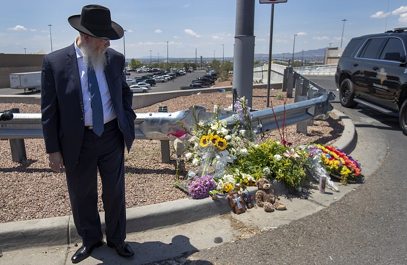 Rabbi Yisrael Greenberg looks at a makeshift memorial while paying tribute to the victims of the Saturday mass shooting at a shopping complex in El Paso, Texas.