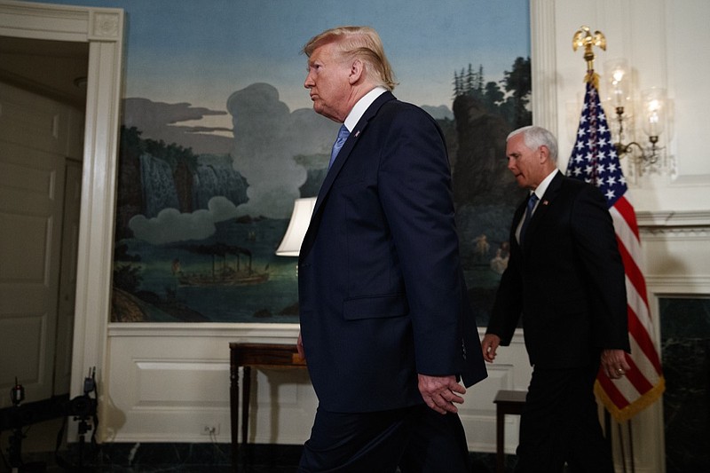 Vice President Mike Pence follows President Donald Trump as he walks off after speaking about the mass shootings in El Paso, Texas and Dayton, Ohio, in the Diplomatic Reception Room of the White House, Monday, Aug. 5, 2019, in Washington. (AP Photo/Evan Vucci)