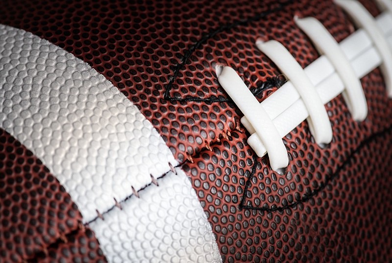 Macro shot of American football ball background football tile / Getty Images
