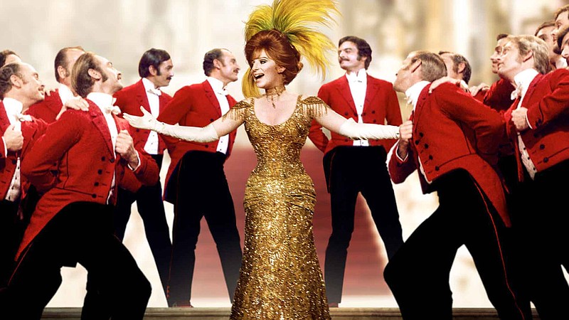 Barbra Streisand as Dolly Levi makes her grand entrance at the Harmonia Gardens in "Hello, Dolly!" during the musical's iconic title song. / Fathom Events Contributed Photo/20th Century Fox Image