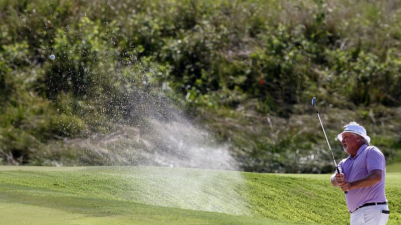 Staff photo by C.B. Schmelter/ Kip Henley hits out of a sand trap on the eighth hole during the 104th Tennessee State Amateur Championship at The Honors Course on Tuesday, Aug. 6, 2019 in Ooltewah, Tenn.