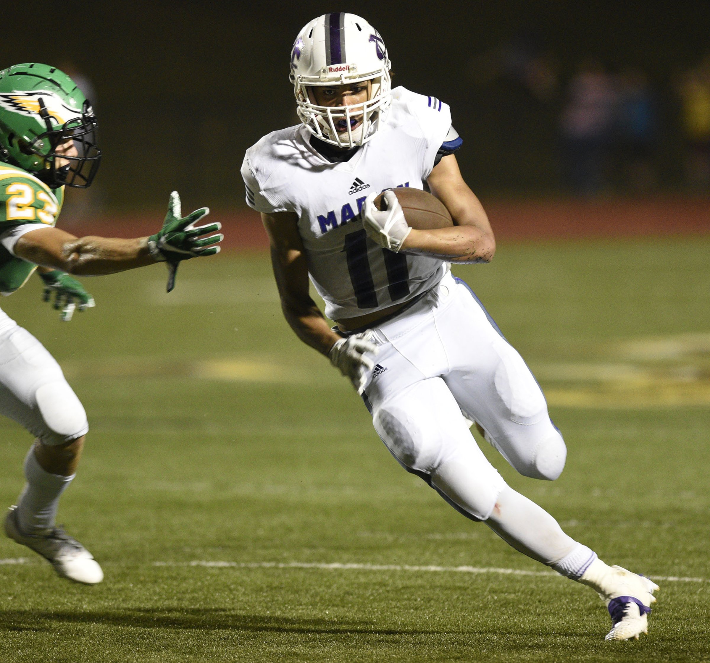 Alex Nunez (11) gets by a Rhea defender for yardage. The Marion County Warriors visited the Rhea County Golden Eagles in a TSSAA rivalry game on October 5, 2018.