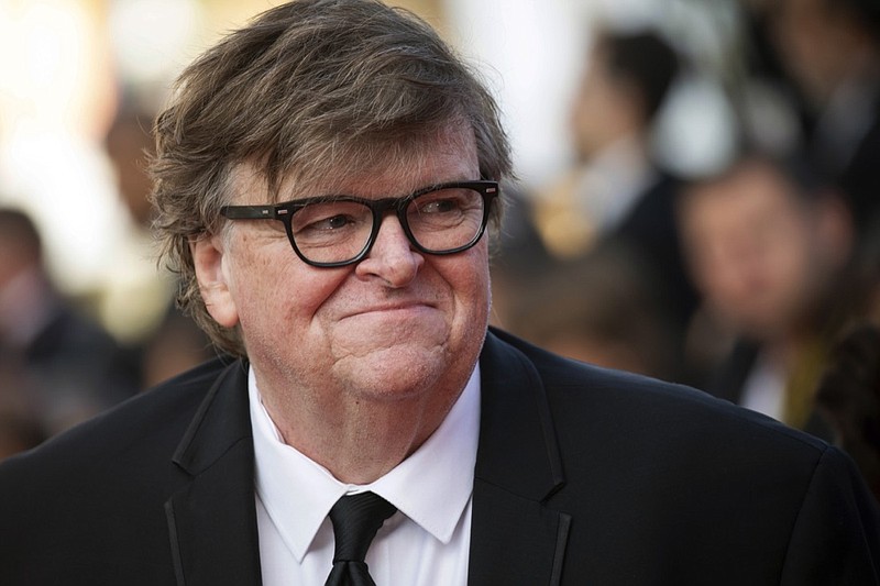 This May 25, 2019, file photo shows Michael Moore at the awards ceremony of the 72nd international film festival, Cannes, southern France. In "Planet of the Humans," which premiered Wednesday, July 31, at the Traverse City Film Festival, he and director Jeff Gibbs pull the curtain back on the false promises of alternative energy, from electric cars to windmills and biomass, and expose why they're not working. (Photo by Vianney Le Caer/Invision/AP, File)