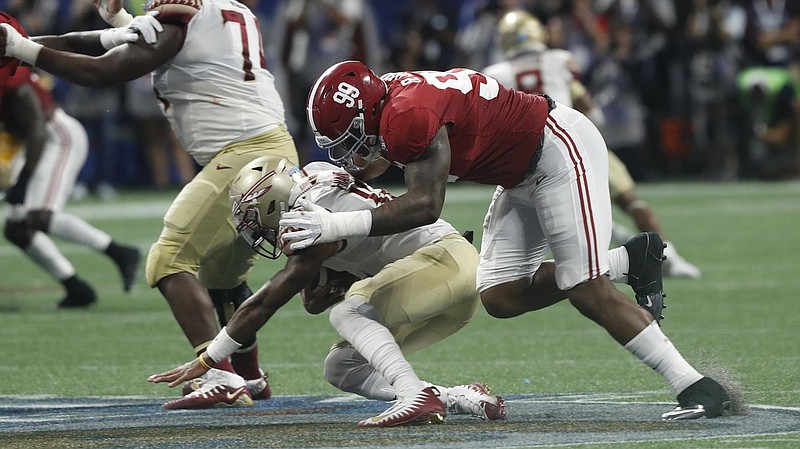 Alabama defensive lineman Raekwon Davis ignited his stellar sophomore season in 2017 with this sack against Florida State, but his junior year with the Crimson Tide was not as productive. / Alabama photo/Kent Gidley