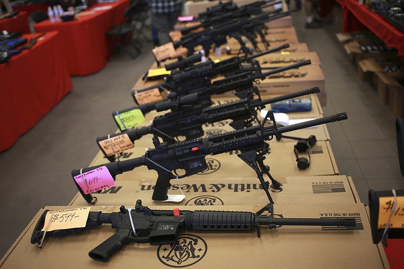 Smith & Wesson AR-15 rifles for sale are shown at a 2014 gun show in Loveland, Colorado.