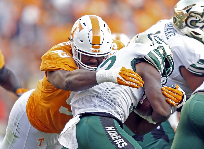 In this Nov. 3, 2018, file photo, Tennessee defensive lineman Emmit Gooden (93) tackles Charlotte running back Benny LeMay (32) during the first half of an NCAA college football game in Knoxville, Tenn. Gooden will miss the entire season with a knee injury, leaving the Volunteers without their most experienced player on a defensive line that has no returning starters. Vols coach Jeremy Pruitt says Gooden tore his anterior cruciate ligament Tuesday, Aug. 6, and will undergo surgery next week. (AP Photo/Wade Payne, File)