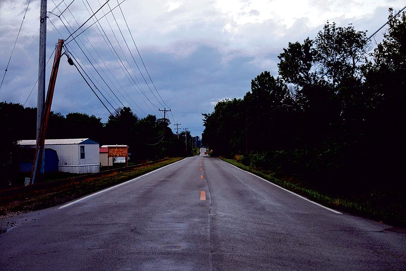 Twilight darkens Wilson Road in Rossville in this June 2019 file photo. The Wilson Road Neighborhood Group is seeking funding to install and maintain streetlights along the road. / Staff file photo by Doug Strickland