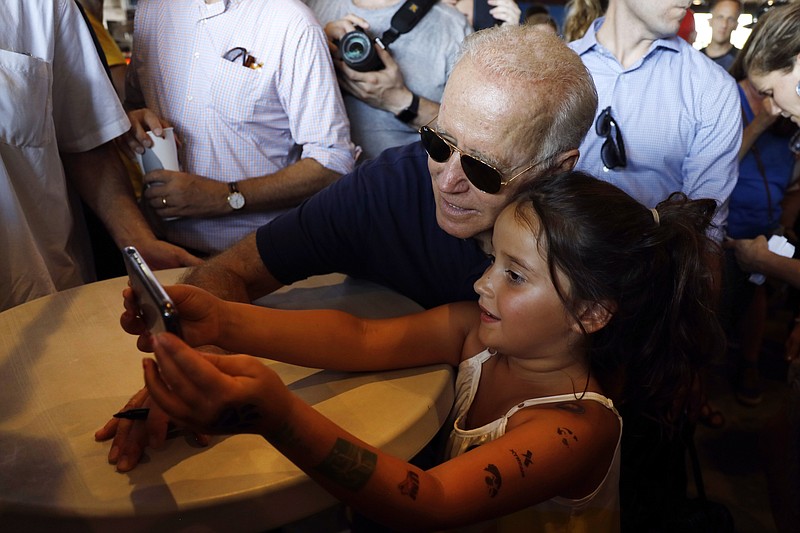 Democratic presidential candidate former Vice President Joe Biden poses for a photo during a visit to the Iowa State Fair last week in Des Moines. (AP Photo/Charlie Neibergall)