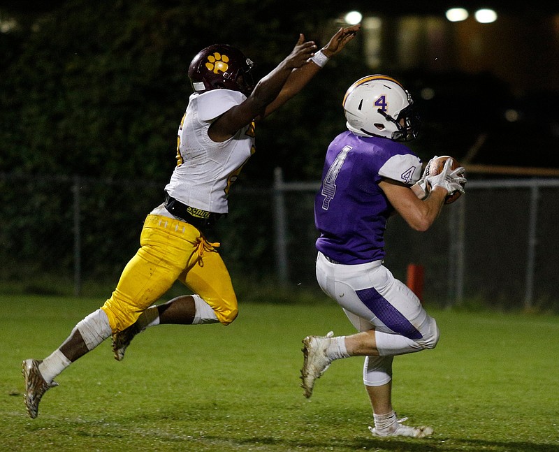Central player Hunter Jones (4) scores a touchdown ahead of Howard player Javion Robinson (6) during their prep football game at Chattanooga Central High School on Friday, Sept. 28, 2018, in Chattanooga, Tenn. 