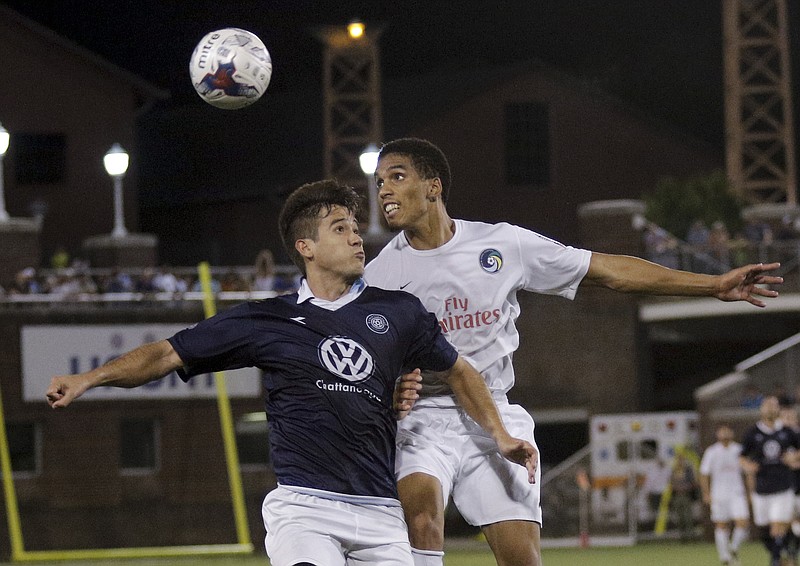 Chattanooga FC's Jose "Zeca" Ferraz, left, and New York Cosmos player Daniel Evuy go up to head the ball in the NPSL national championship match at Finley Stadium on Aug. 8, 2015. The two clubs will open the Members Cup there Saturday night at 7:30.