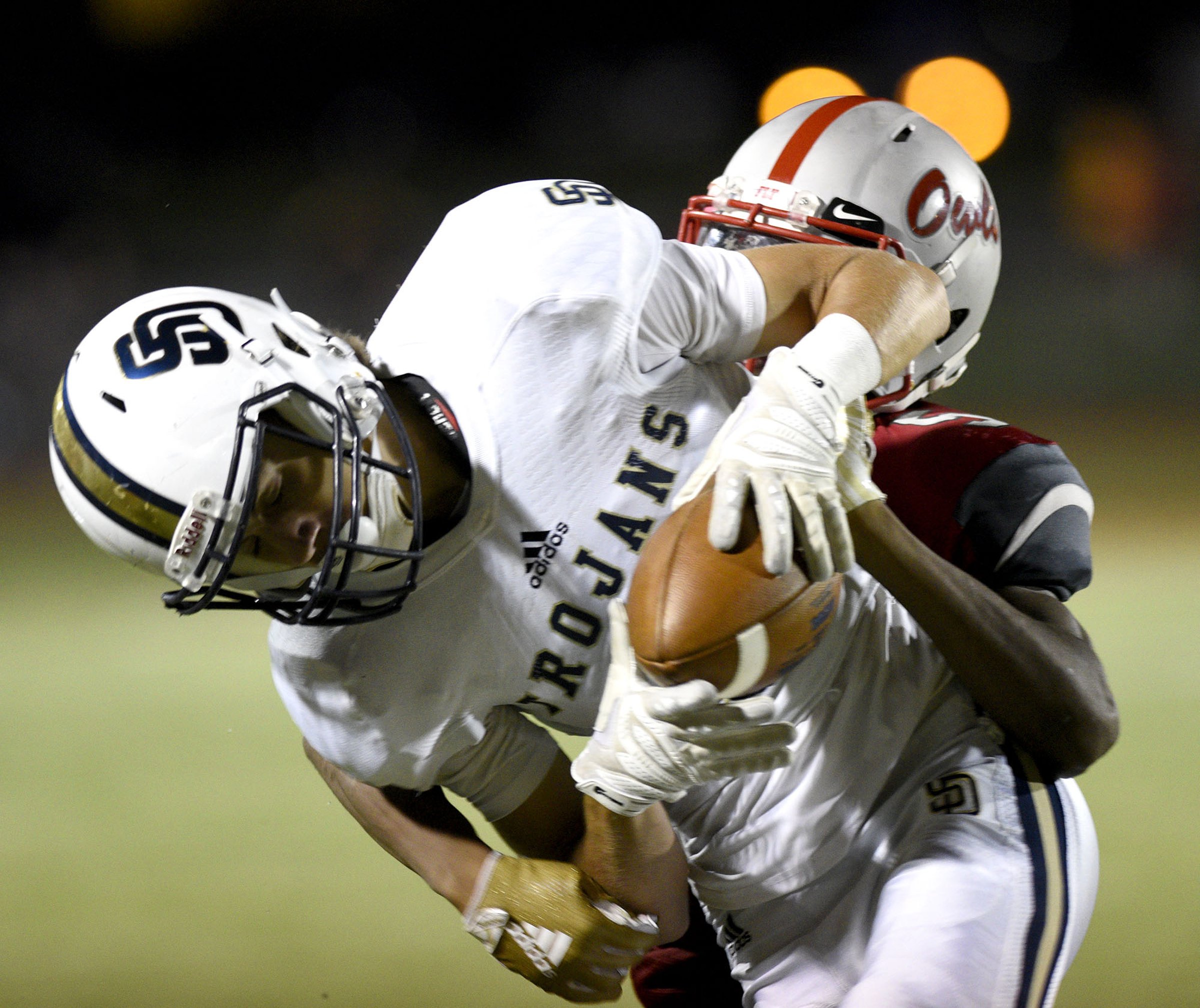 Soddy-Daisy's Garrett Dent, front, makes a catch in tight coverage during a game at Ooltewah in September 2018.