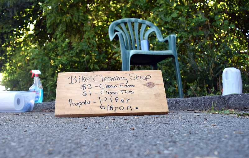 Photo by Mark Pace/Chattanooga Times Free Press — A sign is pictured on Virginia Avenue on August 11, 2019. Six-year-old Piper Gibson set up a bike cleaning business along the bike path.