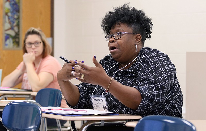 Kimberly Colen, a counselor at East Lake Elementary, participates in a breakout session at the Hamilton County Schools professional development New Teacher Academy at Hixson Middle School last month.