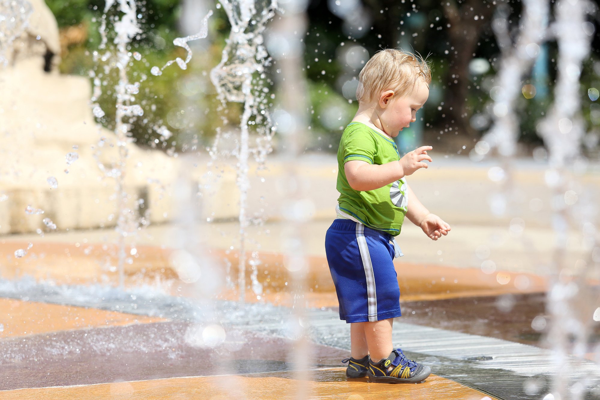 Staff photo by Erin O. Smith / Alexander Langdon, 1, plays in the fountain at Coolidge Park Monday, August 12, 2019 in Chattanooga, Tennessee. Alexander and his mom, who are from Indiana, were visiting Alexander's grandparents in Adairsville, Georgia, and decided to make a day trip to Chattanooga for hiking and cooling off in the park. The heat index on Tuesday is forecast to be over 100.